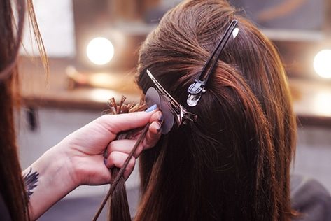 Hair Extensions Being Applied — Hair Salon in Darwin, NT