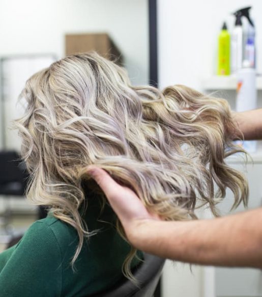 Hairdresser Styling Woman's Hair