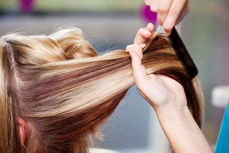 Combing Hair Of Customer — Hair Salon in Darwin, NT