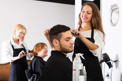Hairdresser Cutting Man's Hair — Hair Salon in Darwin, NT