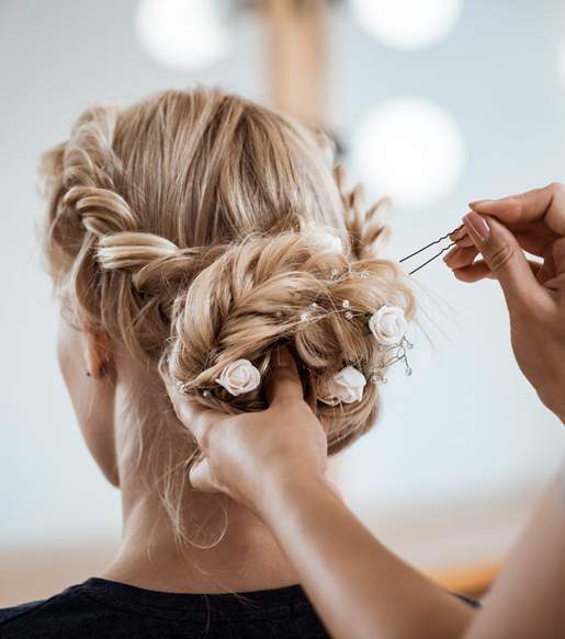 Hairdresser Styling Blonde Hair — Hair Salon in Darwin, NT