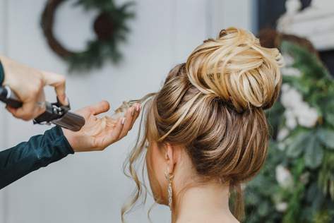 Hairdresser Styling Hair — Hair Salon in Darwin, NT
