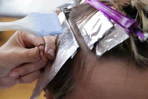 Hairdresser Using Foils On Client's Hair — Hair Salon in Darwin, NT
