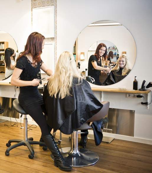 Happy Customer Having Haircut — Hair Salon in Darwin, NT